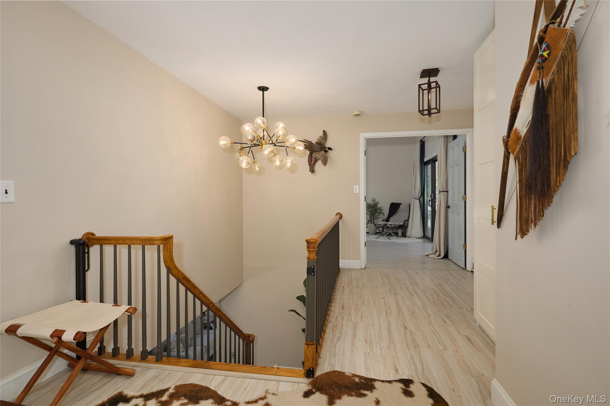 32 Cole Road Pleasant Valley, NY 12569 - Photo 21 of 49 a view of a hallway with couches and a chandelier