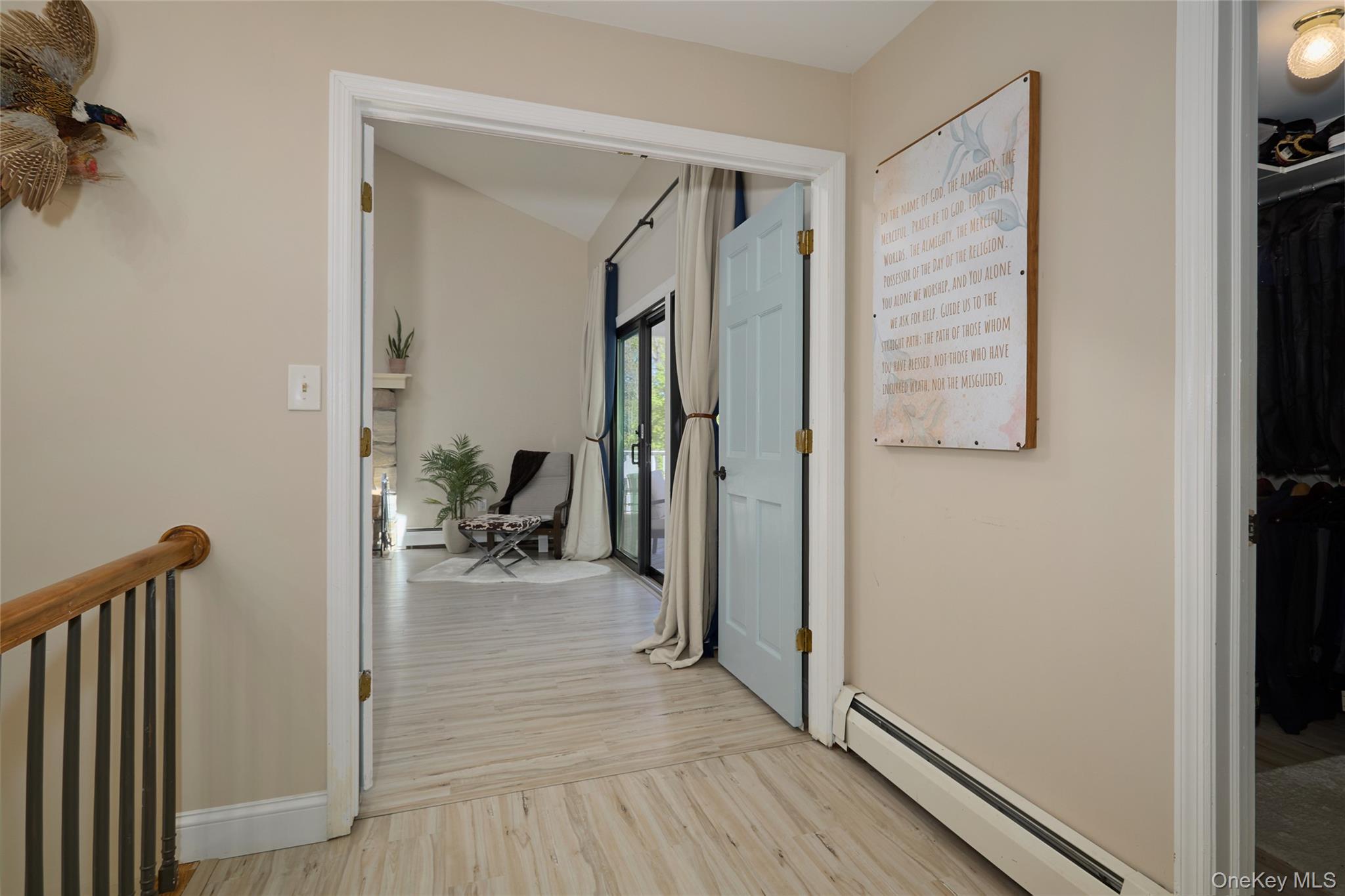 32 Cole Road Pleasant Valley, NY 12569 - Photo 22 of 49 a view of a hallway with wooden floor and a living room