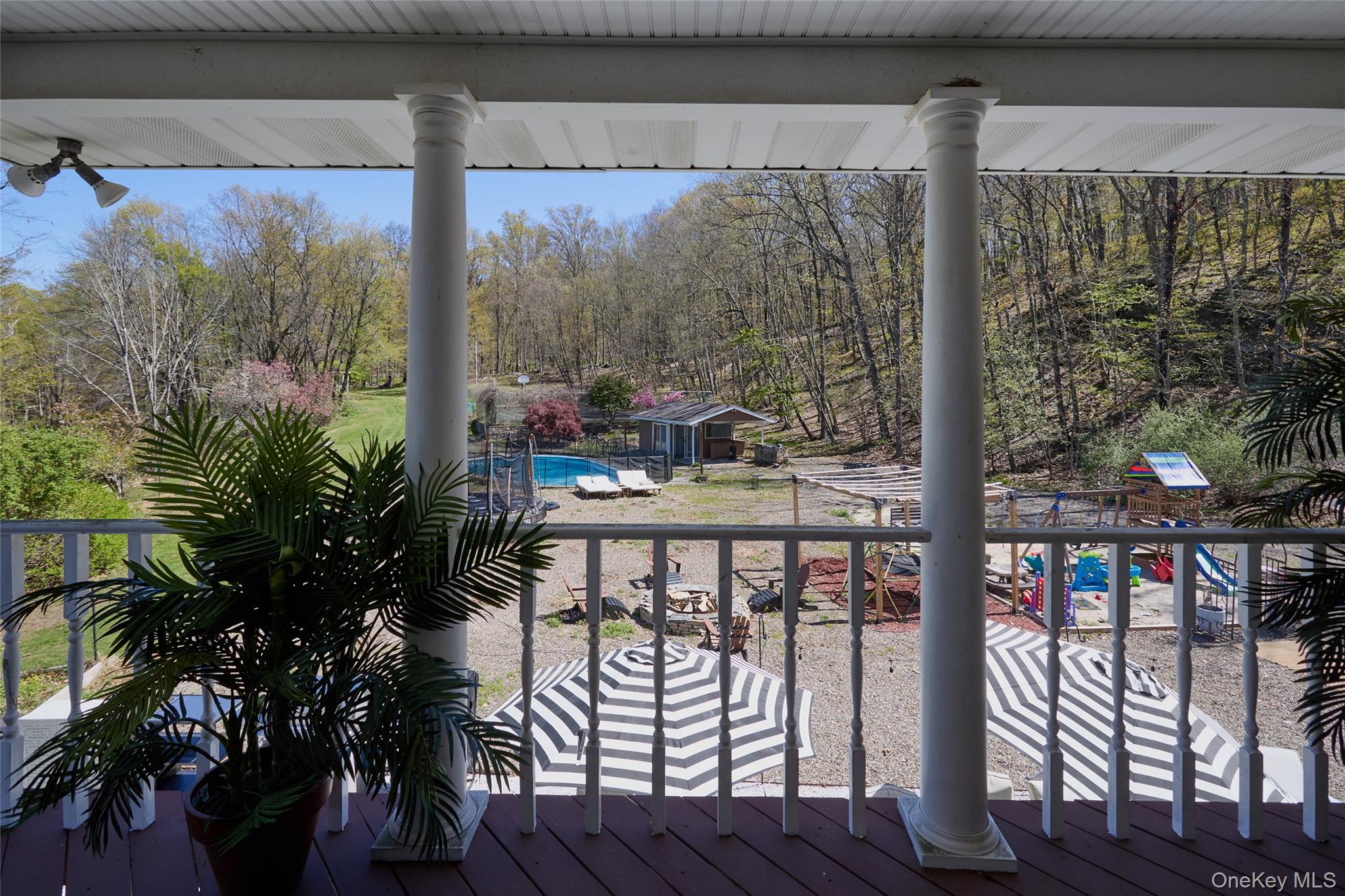 32 Cole Road Pleasant Valley, NY 12569 - Photo 27 of 49 a view of a city from a balcony with furniture