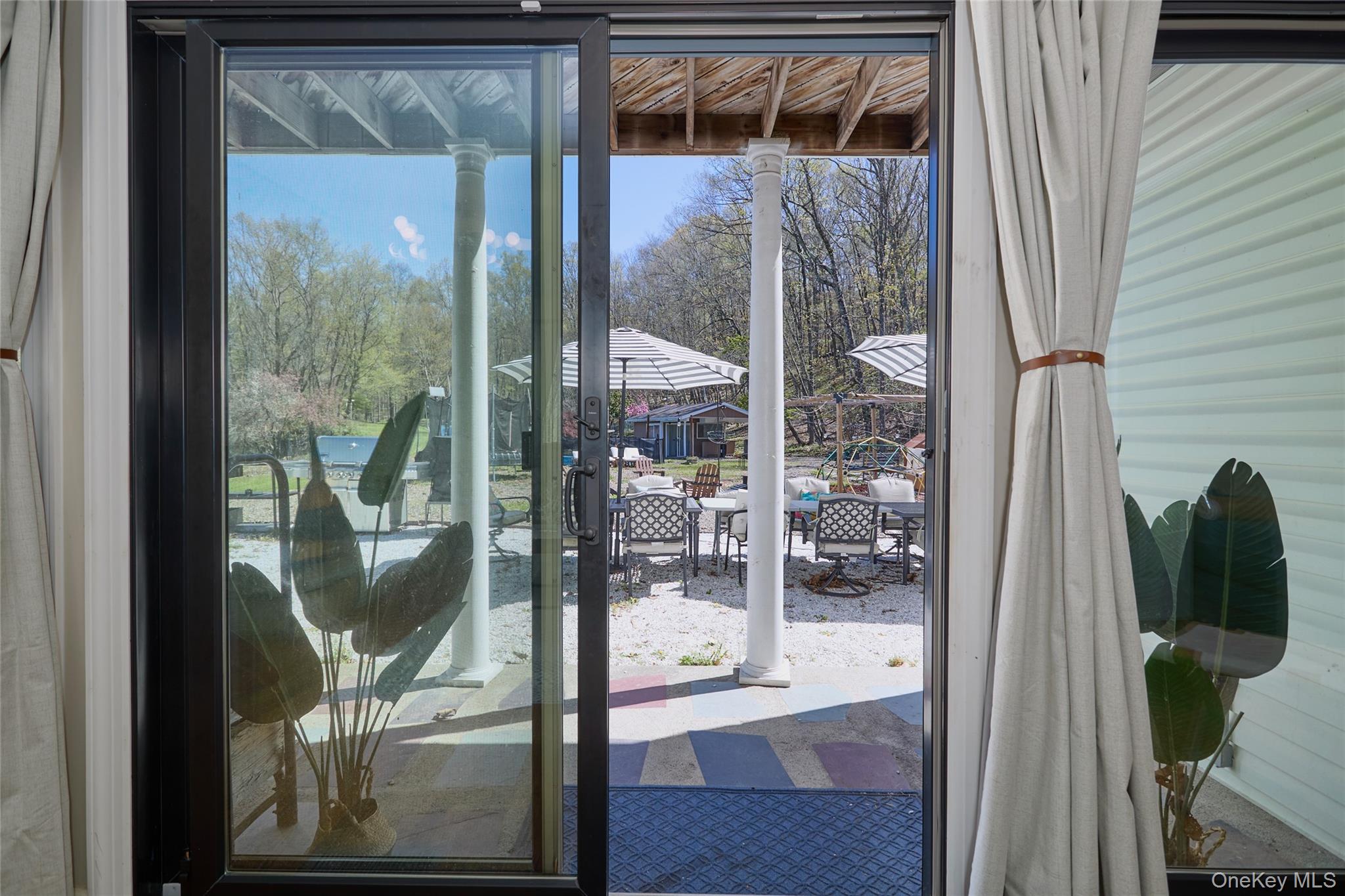 32 Cole Road Pleasant Valley, NY 12569 - Photo 29 of 49 a glass door with a glass door and garden