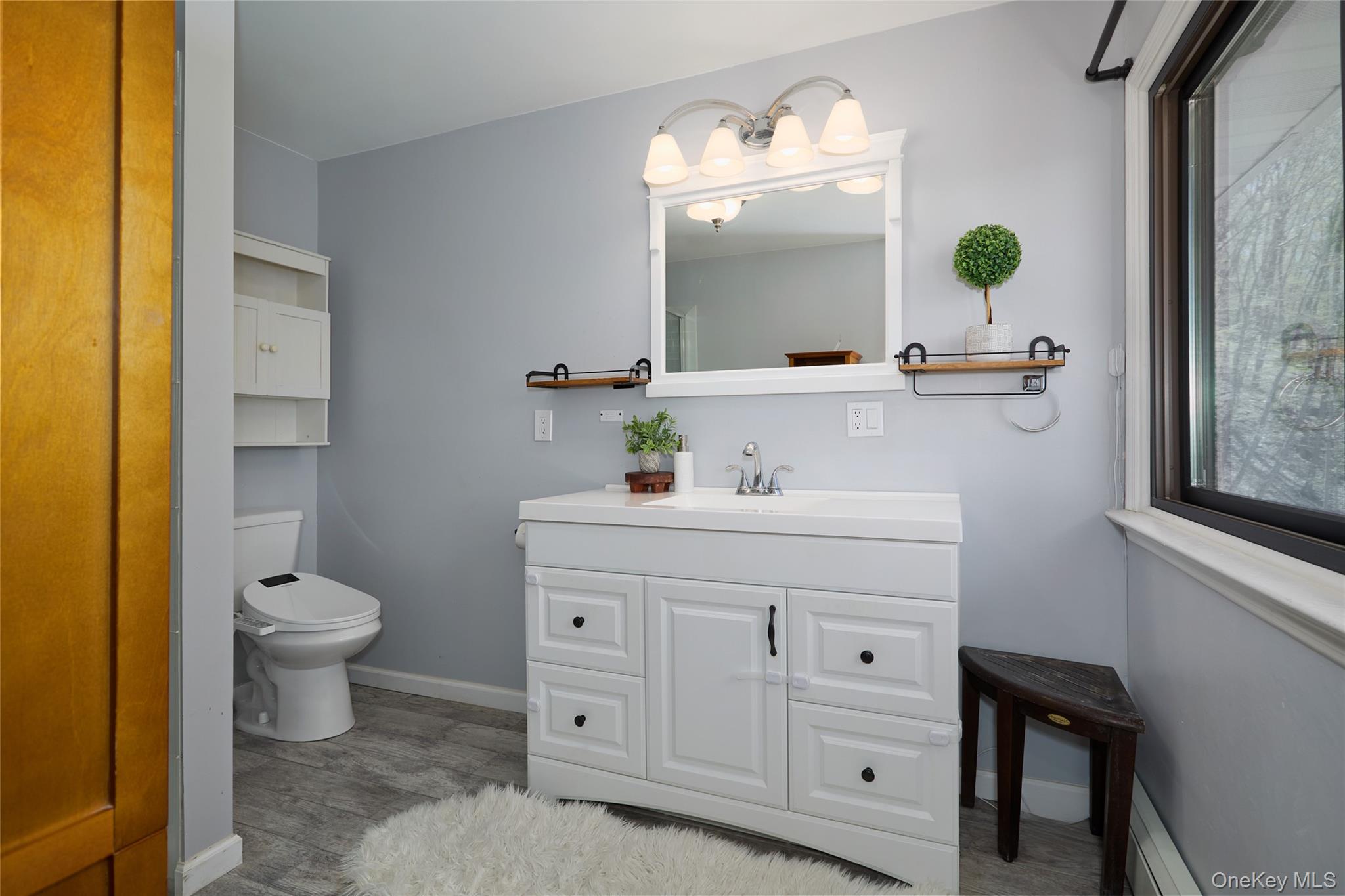 32 Cole Road Pleasant Valley, NY 12569 - Photo 30 of 49 a bathroom with a toilet sink and mirror