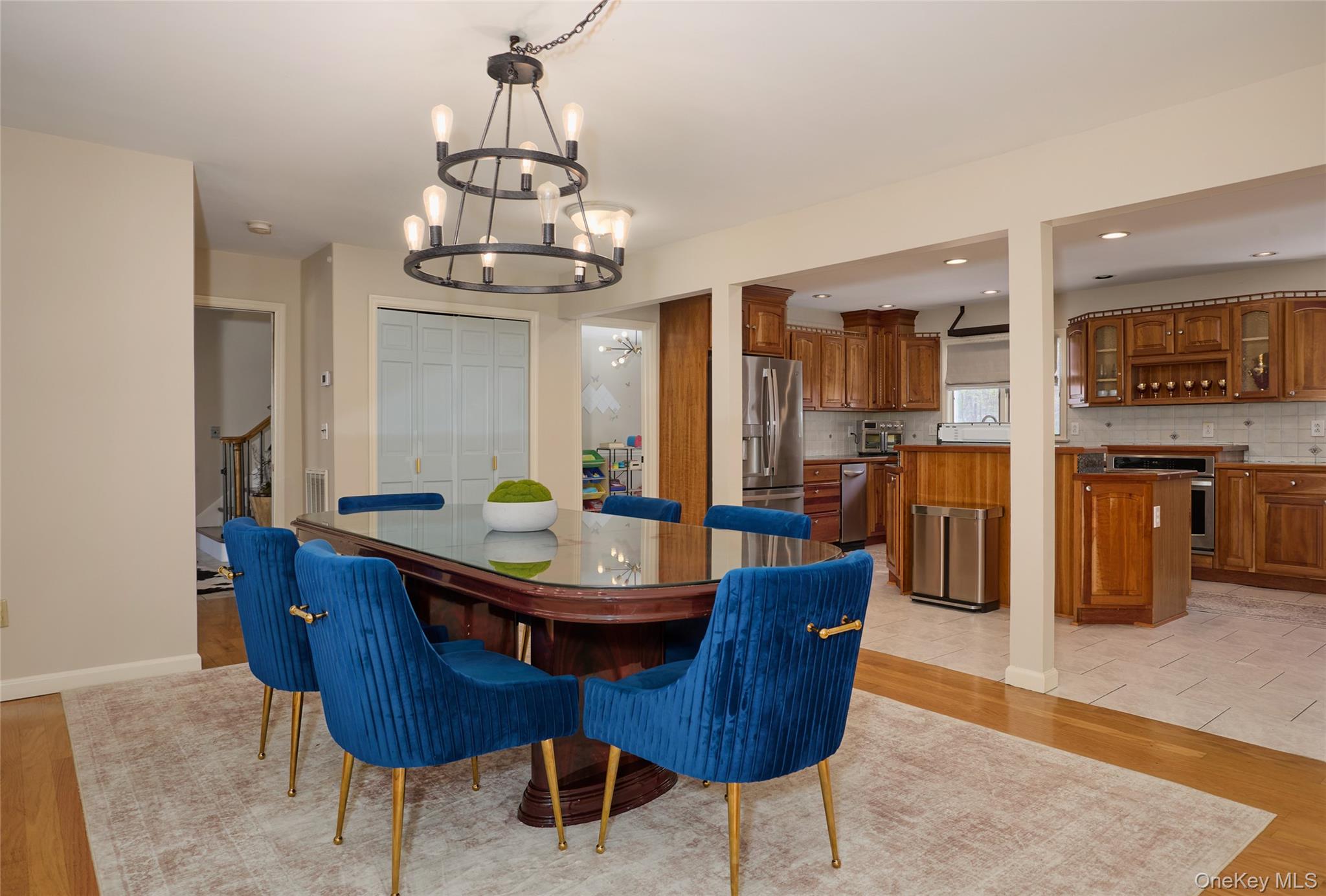 32 Cole Road Pleasant Valley, NY 12569 - Photo 35 of 49 a dining room with wooden floor a chandelier a wooden table and chairs