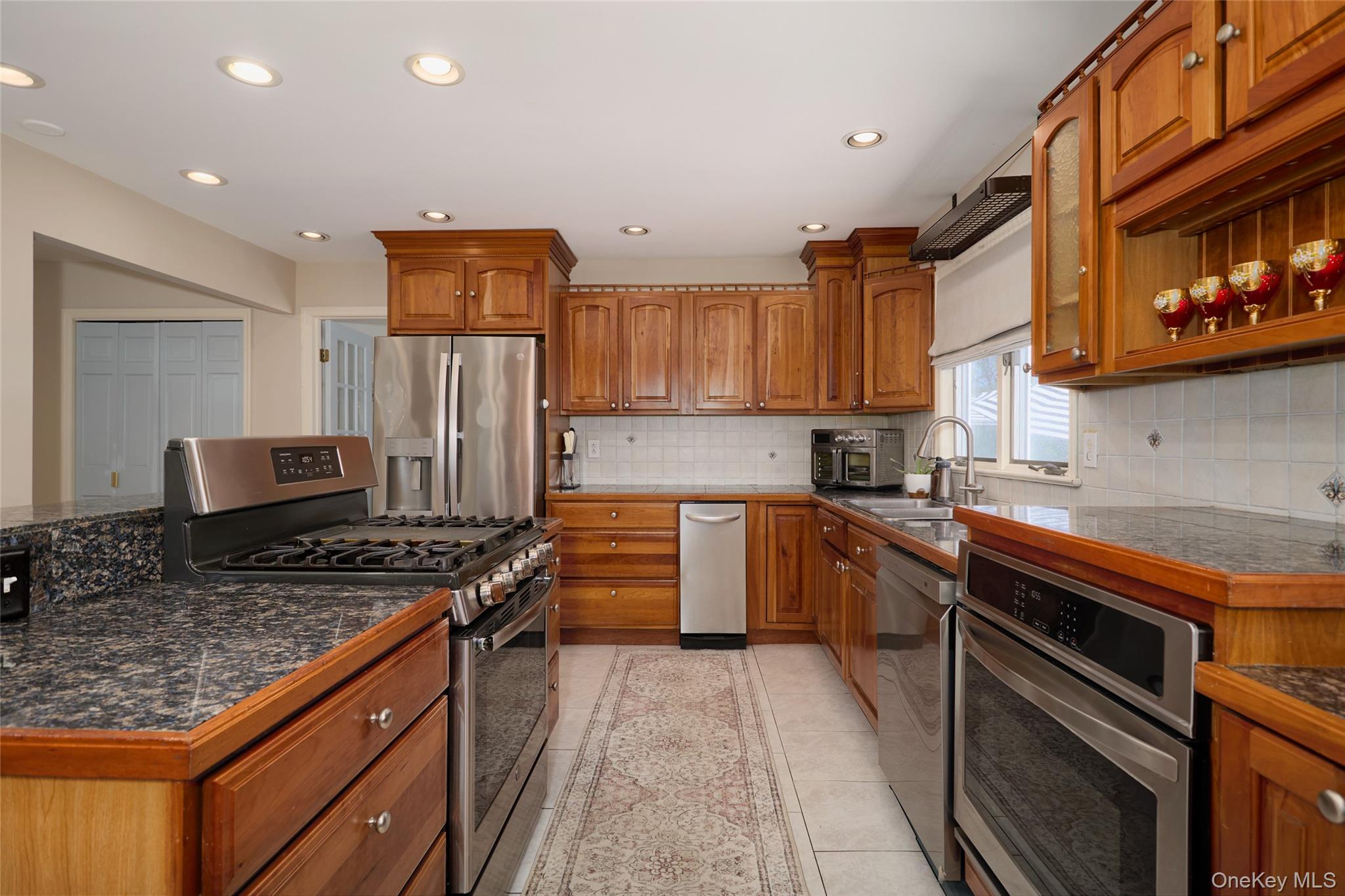 32 Cole Road Pleasant Valley, NY 12569 - Photo 36 of 49 a kitchen with stainless steel appliances granite countertop a stove sink and cabinets