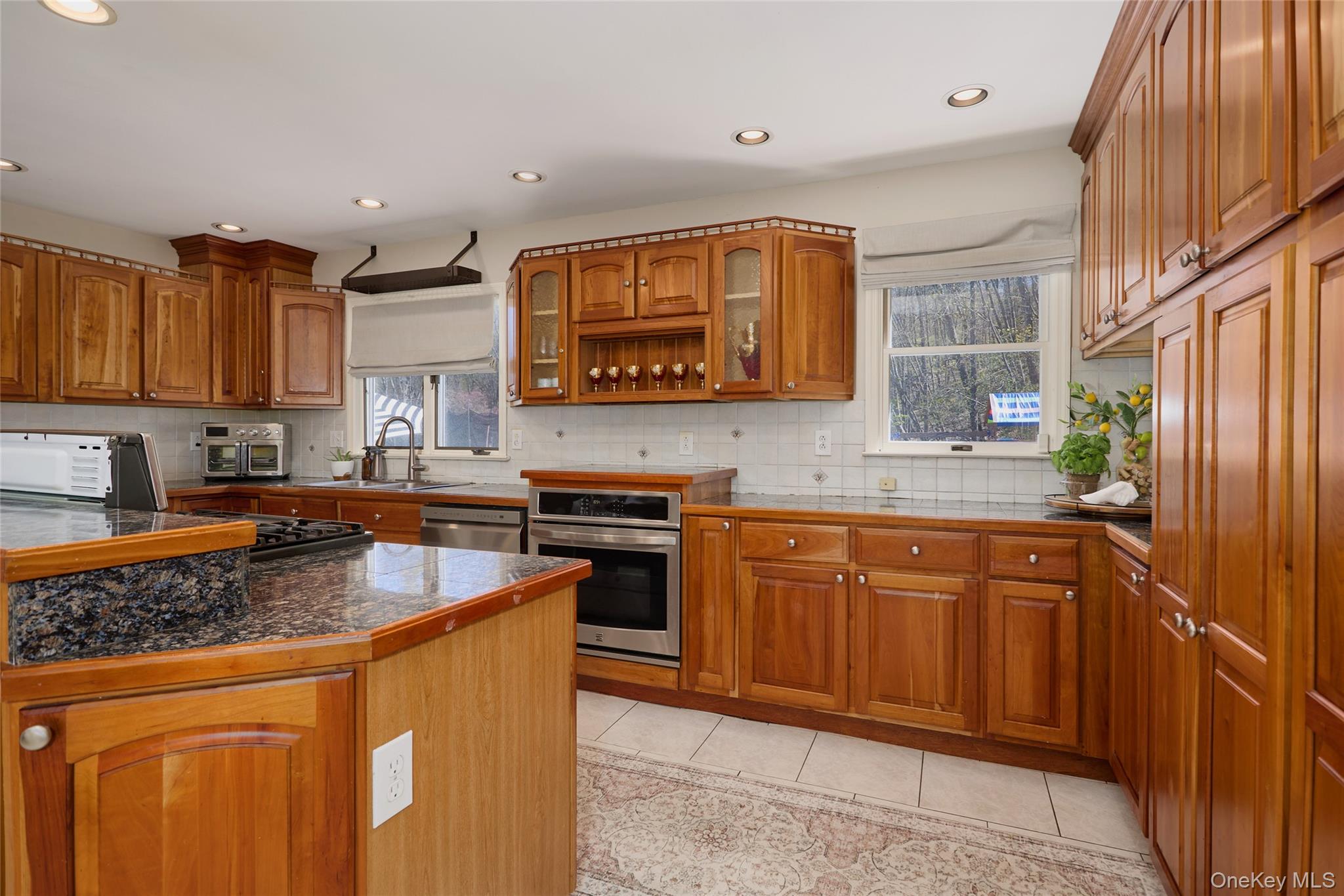 32 Cole Road Pleasant Valley, NY 12569 - Photo 37 of 49 a kitchen with stainless steel appliances granite countertop a sink stove and refrigerator