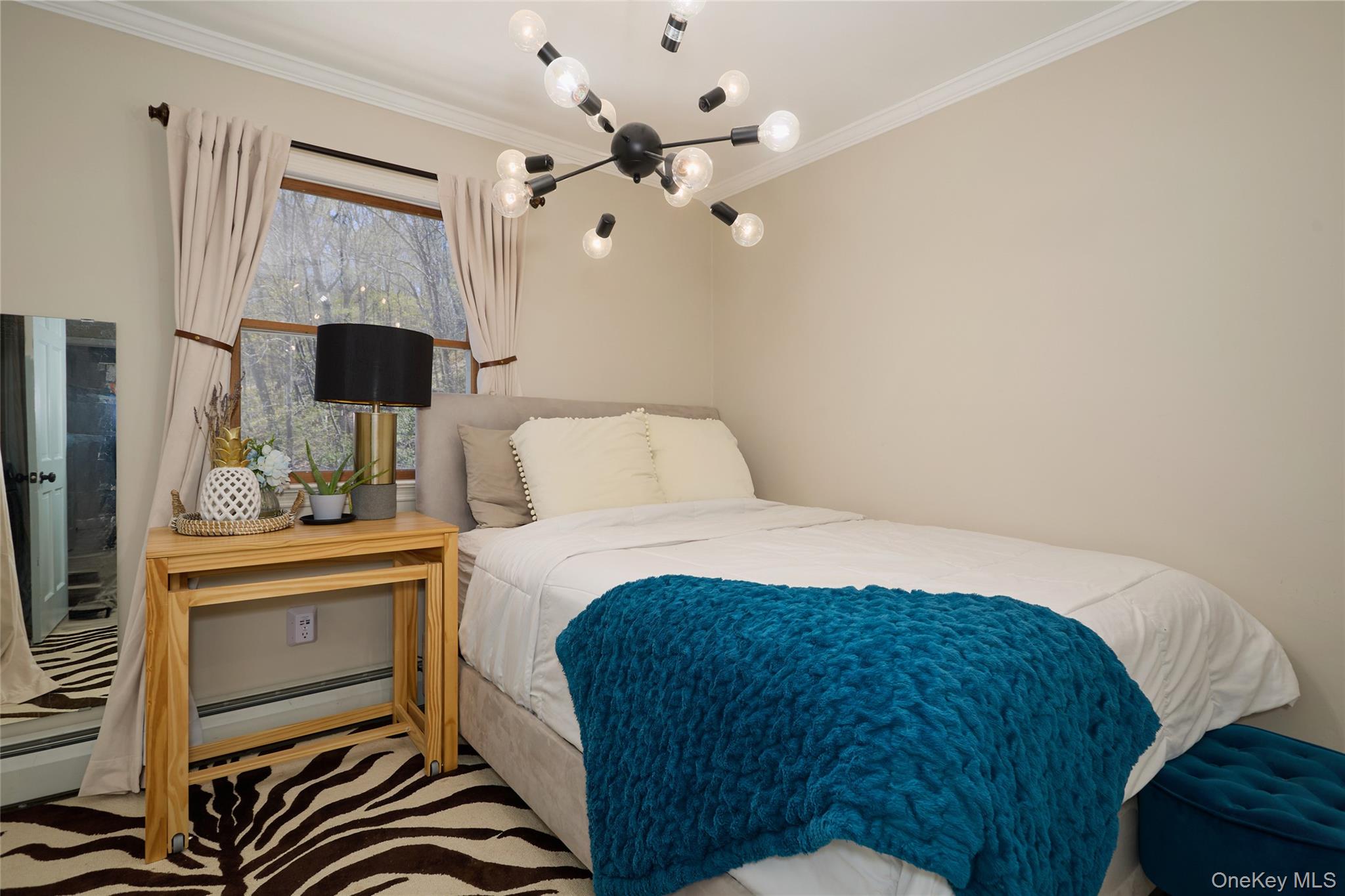 32 Cole Road Pleasant Valley, NY 12569 - Photo 44 of 49 a bedroom with a bed and a chandelier