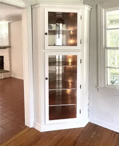 a view of a kitchen with kitchen island and wooden floor