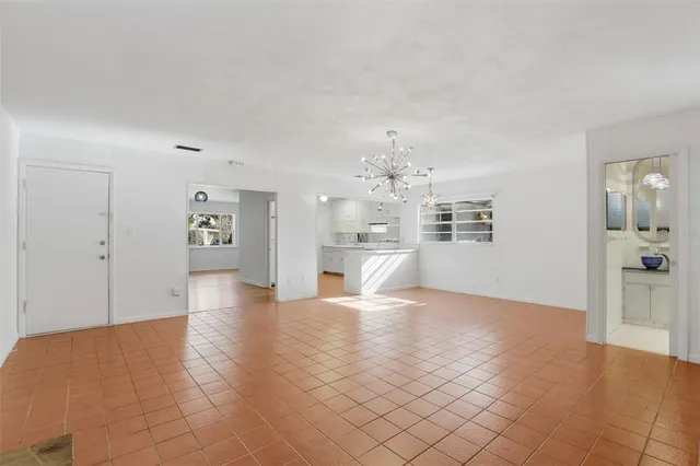 a kitchen with kitchen island sink cabinets and window