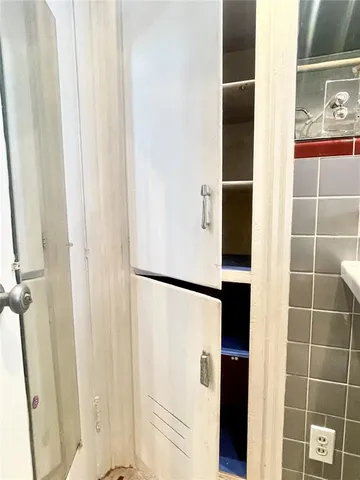 a bathroom with a sink a mirror and shower