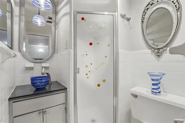 a view of a hallway with wooden floor and closet