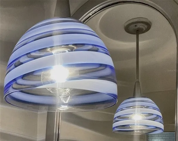 a view of staircase with kitchen view