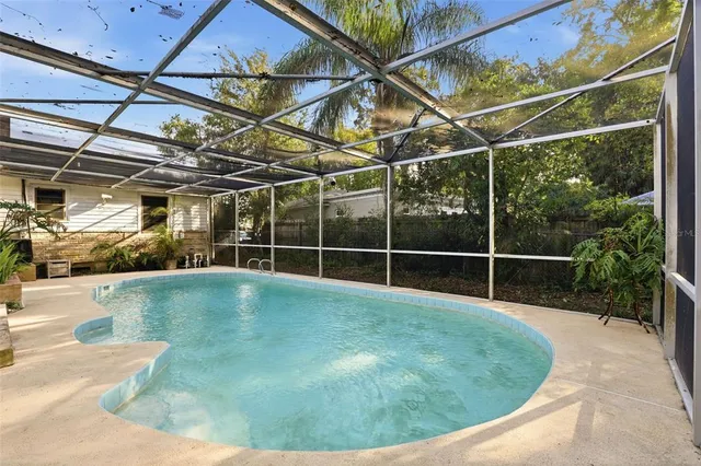 a view of a house with a backyard and porch
