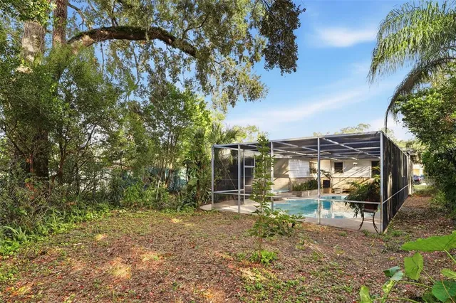 a backyard of a house with lots of green space