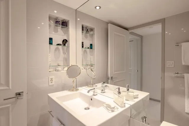 a bathroom with a sink and a mirror