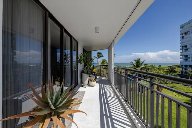 a view of a balcony with chairs