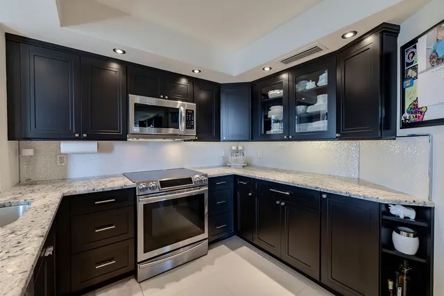 a kitchen with a stove and a microwave