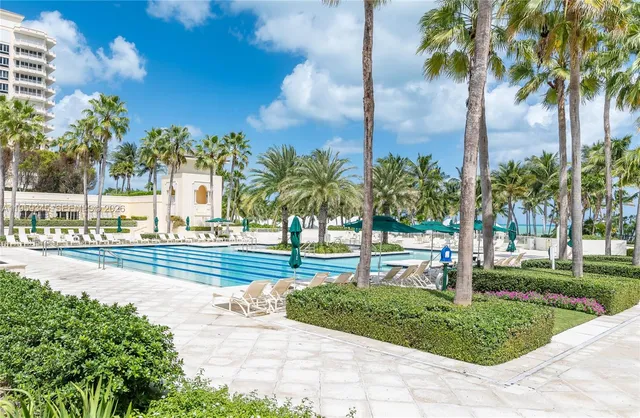 a view of a yard and palm trees