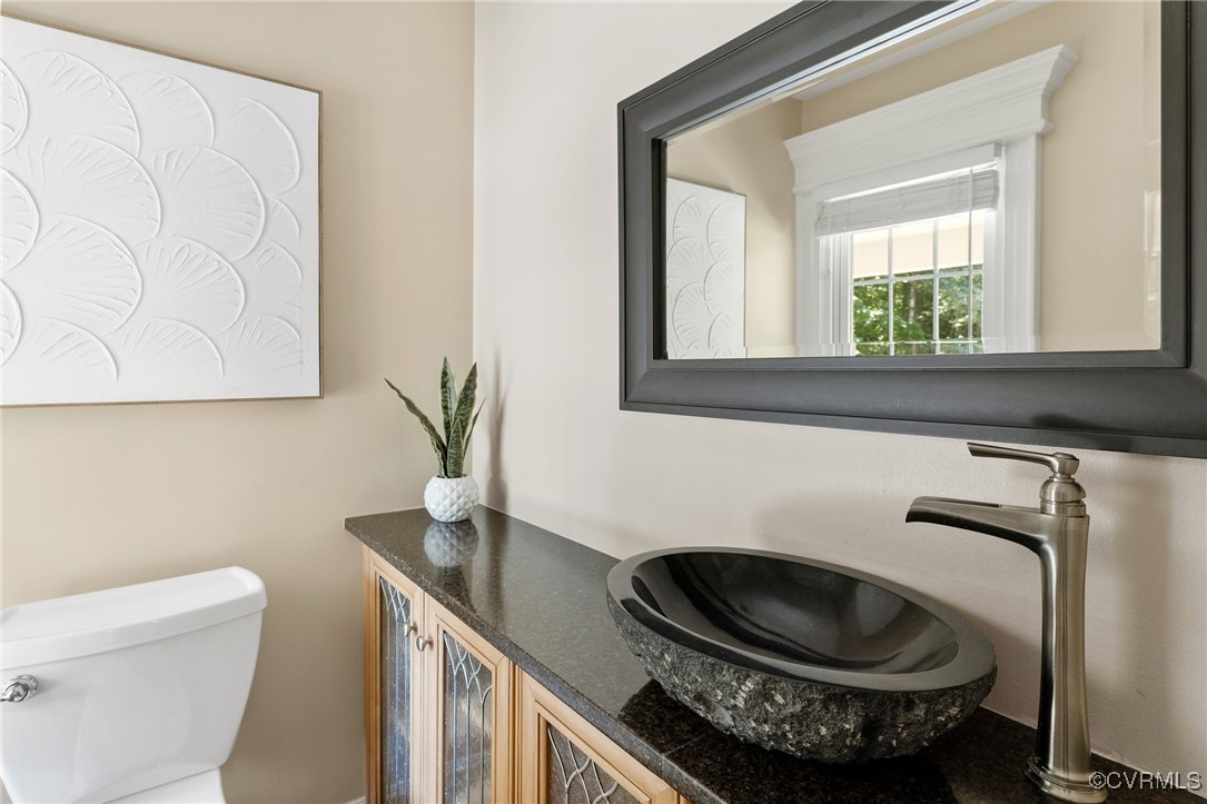 9850 Taylor Road Chesterfield, VA 23838 - Photo 11 of 38 a bathroom with a sink a toilet and a mirror