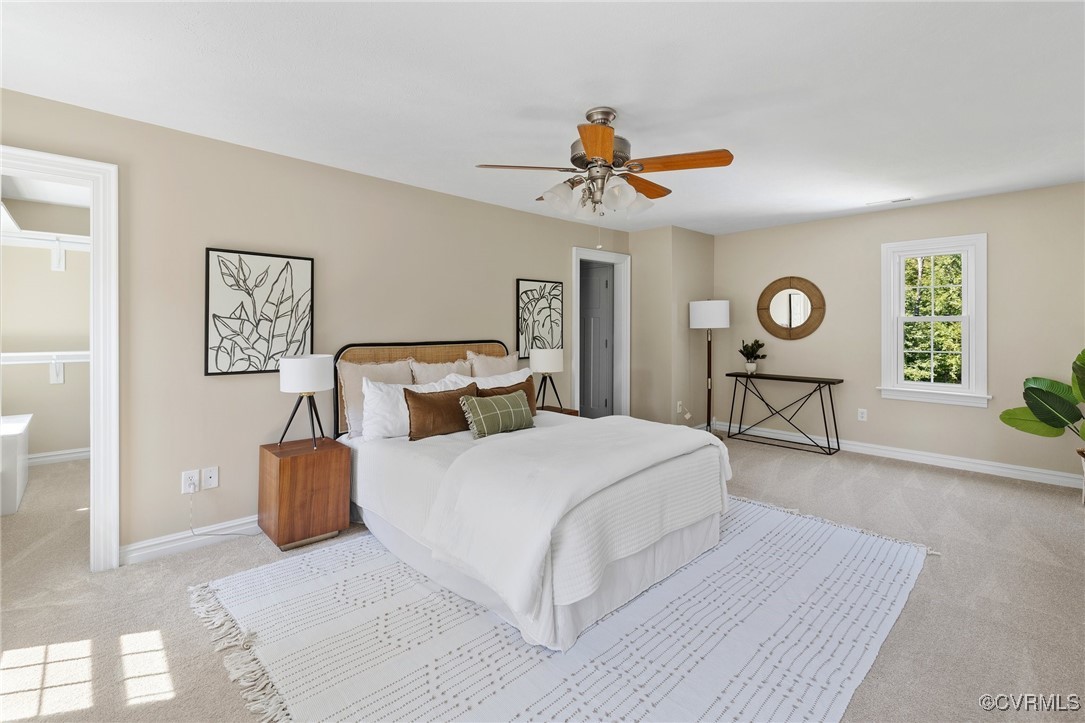 9850 Taylor Road Chesterfield, VA 23838 - Photo 12 of 38 a bedroom with a bed and a chandelier