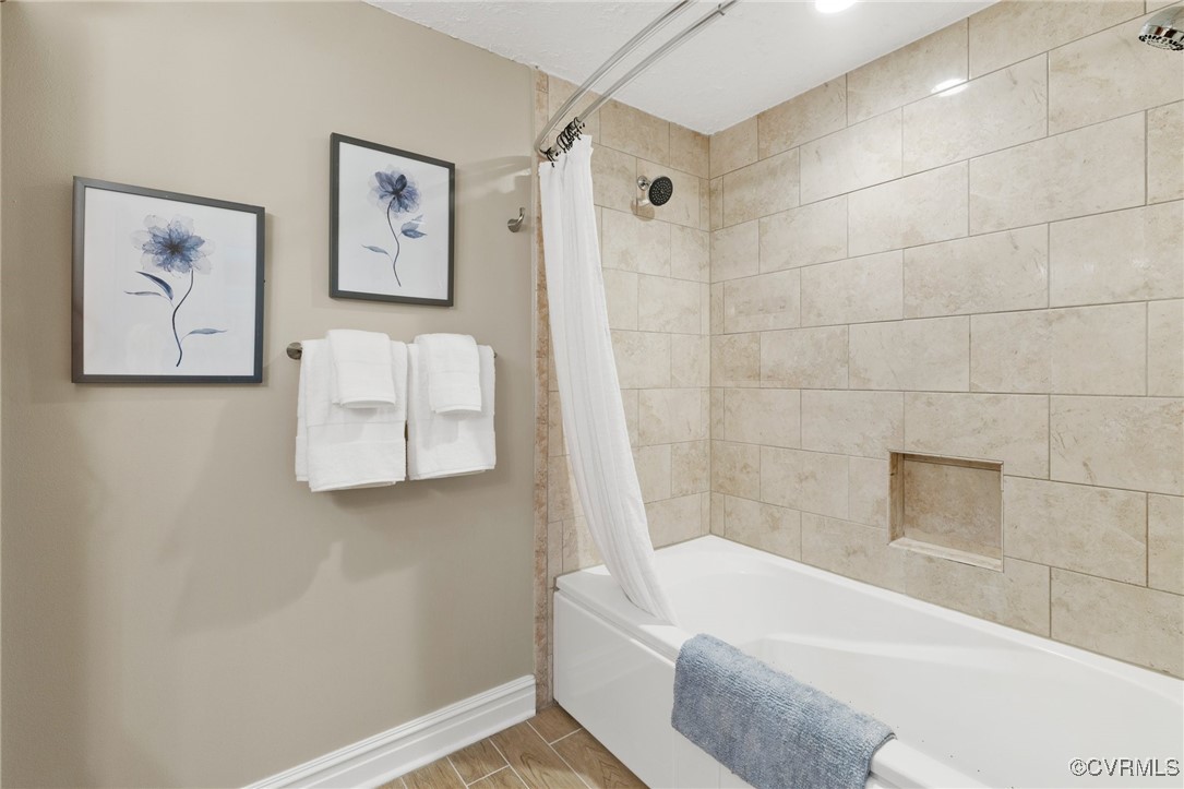 9850 Taylor Road Chesterfield, VA 23838 - Photo 14 of 38 a bathroom with a bathtub and a shower