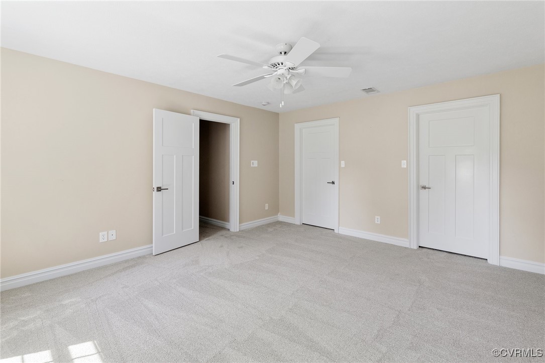 9850 Taylor Road Chesterfield, VA 23838 - Photo 17 of 38 an empty room with a ceiling fan and a window