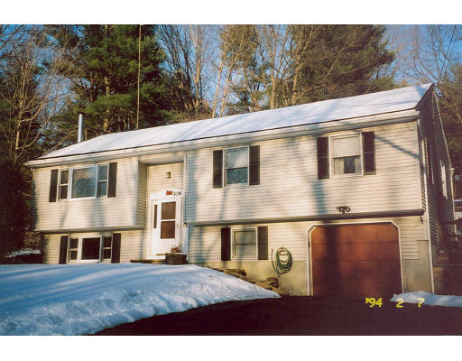 106 Clark Road Sturbridge, MA 01518 - Photo 1 of 6 a front view of a house with yard