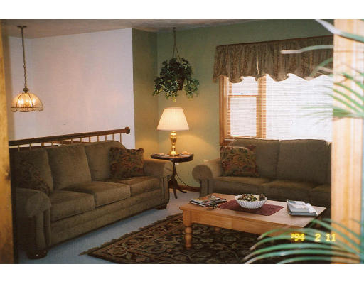 106 Clark Road Sturbridge, MA 01518 - Photo 3 of 6 a living room with furniture and a large window