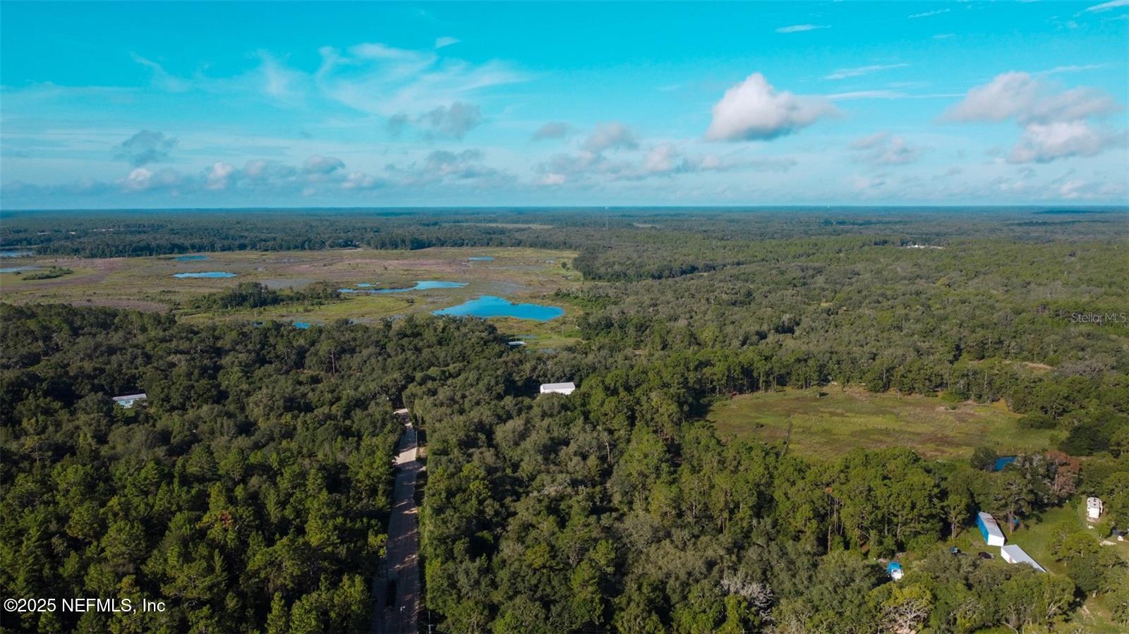 0 Lake Bundy Road Melrose, FL 32666 - Photo 3 of 9 a view of a lake with a city
