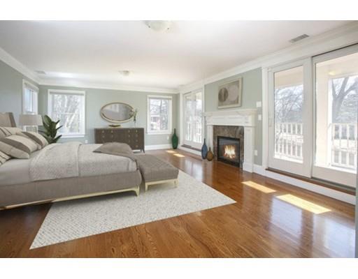 157 Dickerman Road Newton, MA 02461 - Photo 12 of 25 a bedroom with a large bed and a fireplace