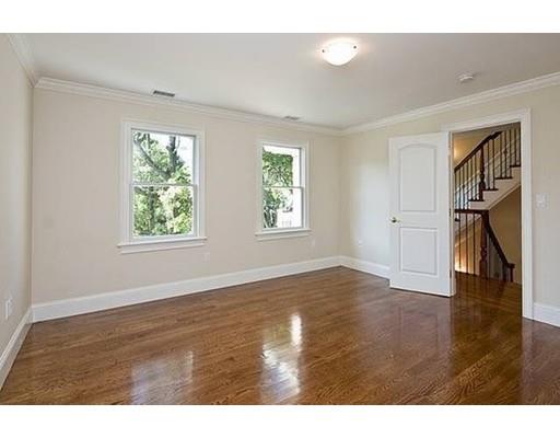 157 Dickerman Road Newton, MA 02461 - Photo 16 of 25 a view of an empty room with wooden floor and a window