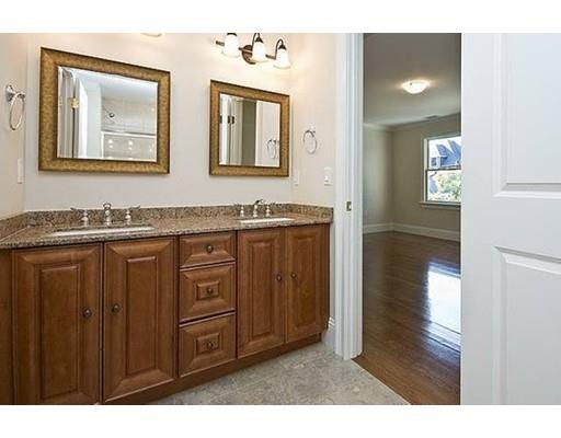 157 Dickerman Road Newton, MA 02461 - Photo 19 of 25 a bathroom with a granite countertop sink vanity and mirror