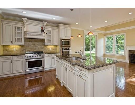 157 Dickerman Road Newton, MA 02461 - Photo 5 of 25 a kitchen with stainless steel appliances kitchen island granite countertop a stove and a sink
