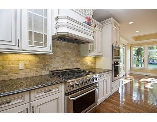 157 Dickerman Road Newton, MA 02461 - Photo 6 of 25 a kitchen with stainless steel appliances granite countertop a stove and a white cabinets