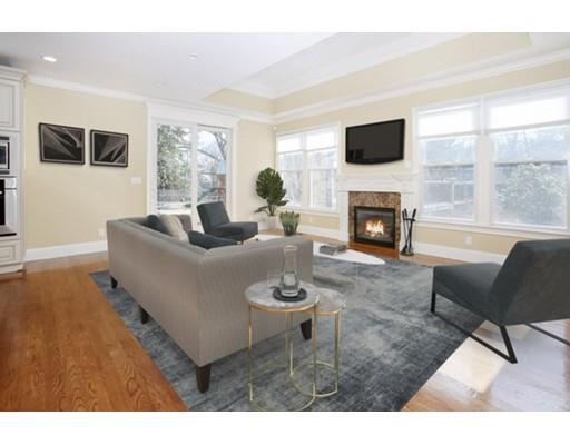 157 Dickerman Road Newton, MA 02461 - Photo 8 of 25 a living room with furniture a fireplace and a flat screen tv