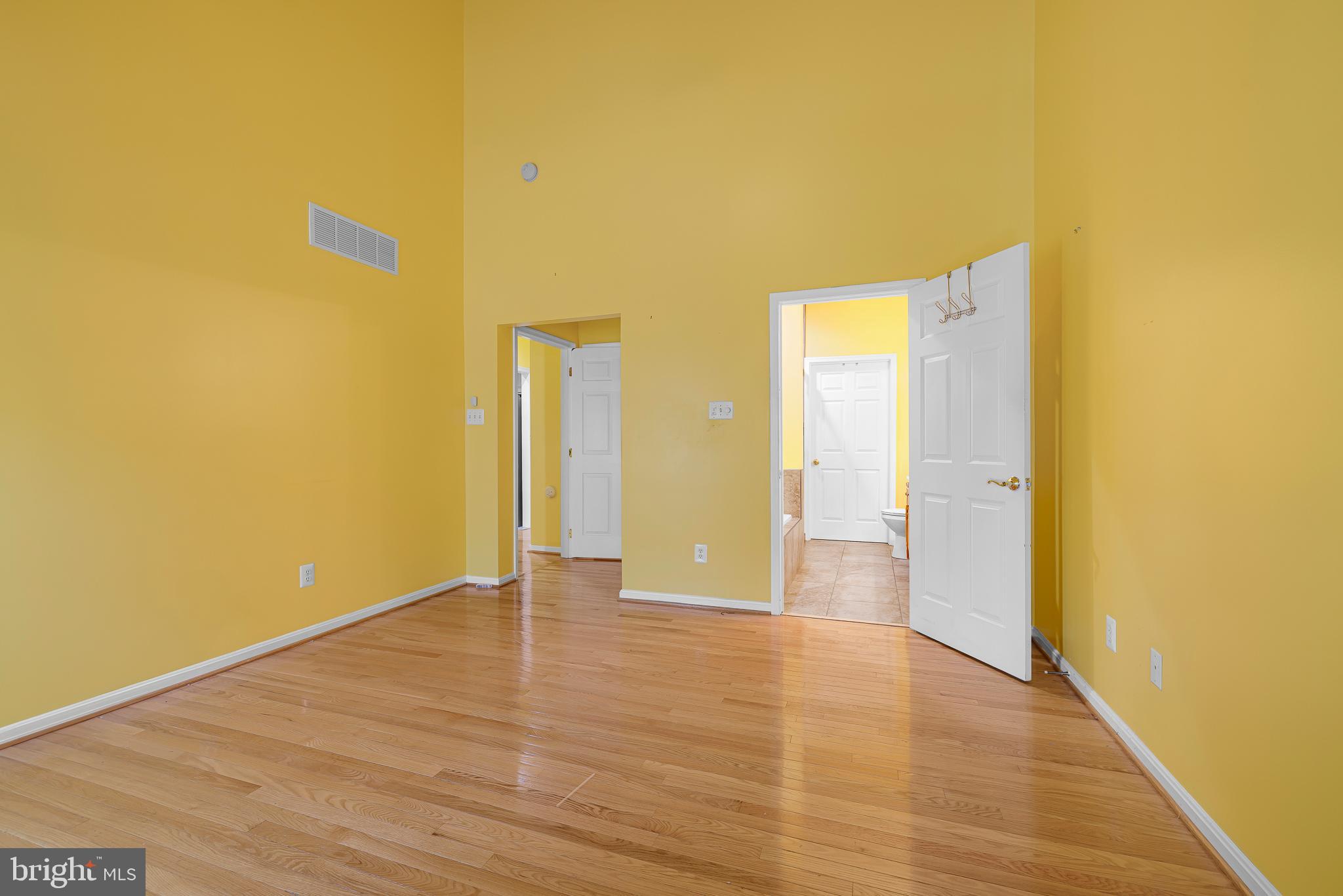 433 Pierce Run Newark, DE 19702 - Photo 11 of 43 a view of an empty room with wooden floor and a window