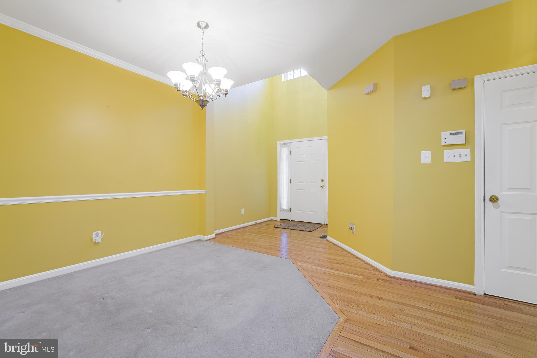 433 Pierce Run Newark, DE 19702 - Photo 14 of 43 a view of a room with wooden floor and chandelier