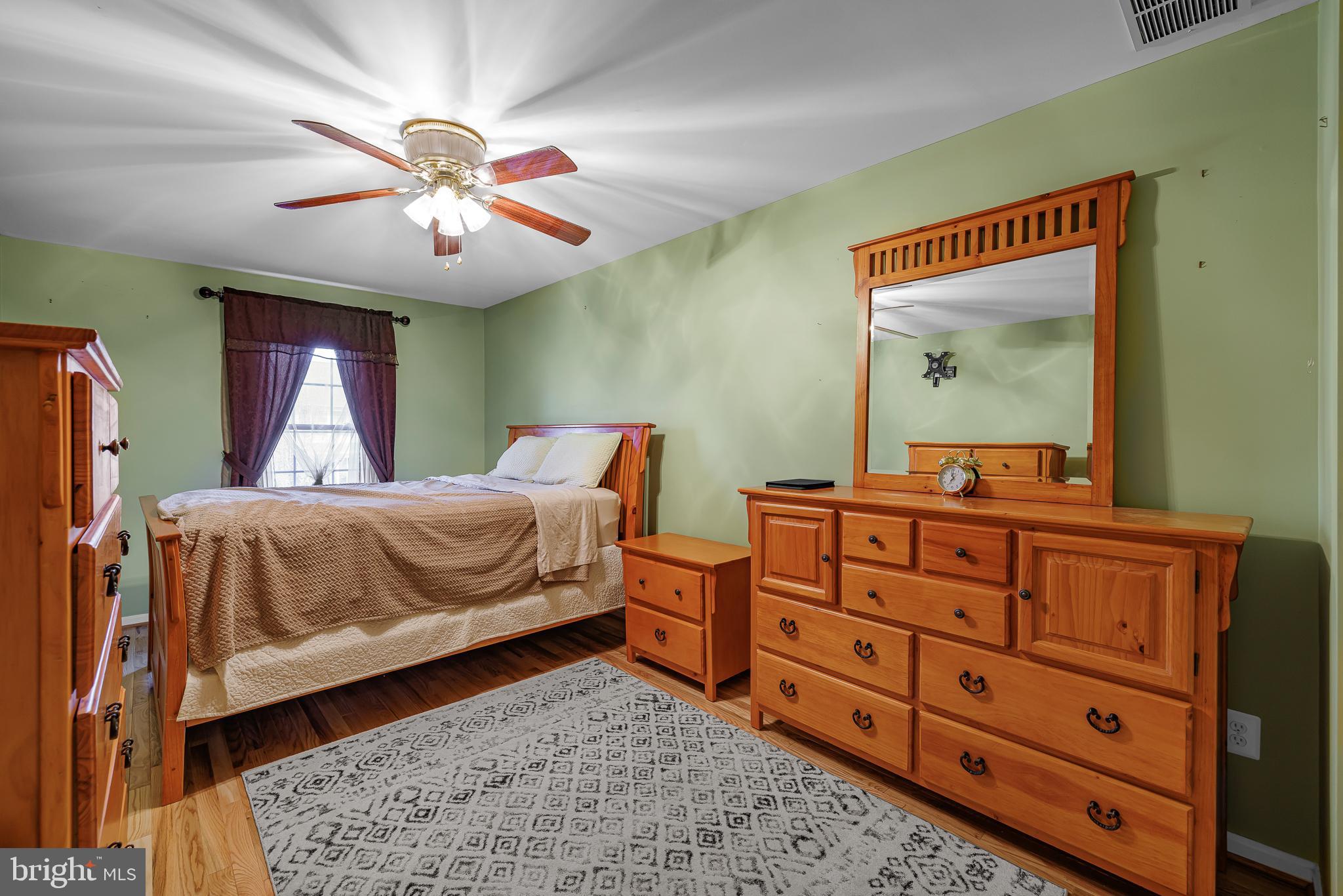 433 Pierce Run Newark, DE 19702 - Photo 24 of 43 a bedroom with a bed and a chandelier