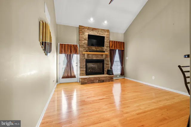 a view of a livingroom with a flat screen tv and fireplace