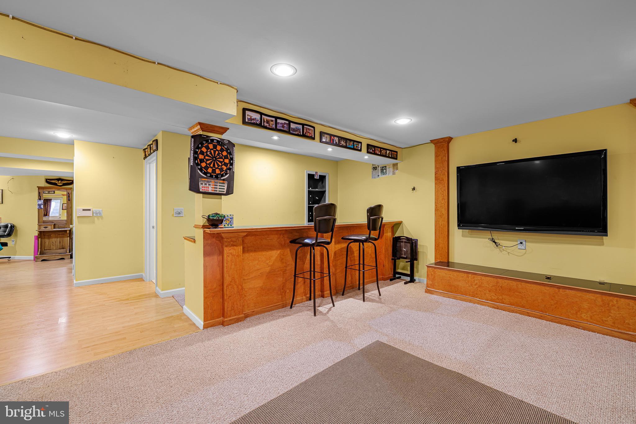 433 Pierce Run Newark, DE 19702 - Photo 33 of 43 a view of a living room with furniture and a flat screen tv