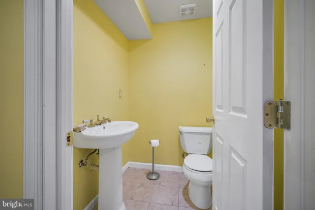 a bathroom with a shower a toilet and a shower