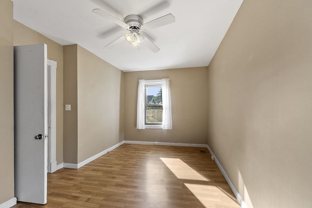 111 Central Street Concord, MA 01742 - Photo 15 of 42 a view of empty room with wooden floor and fan