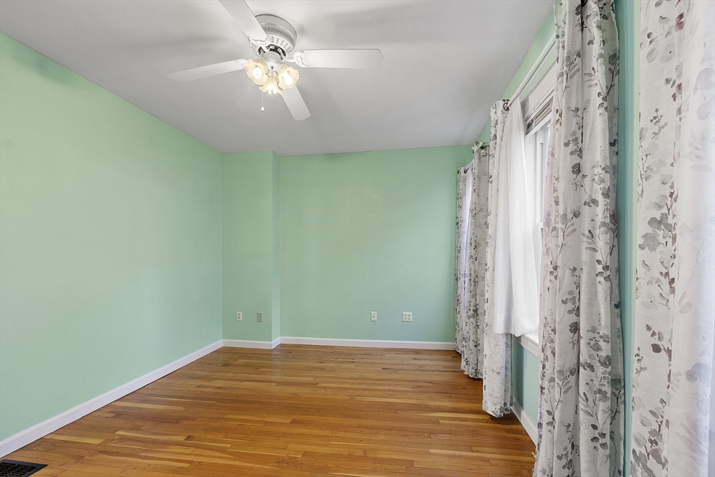 111 Central Street Concord, MA 01742 - Photo 16 of 42 a view of a room with a chandelier fan and wooden floor