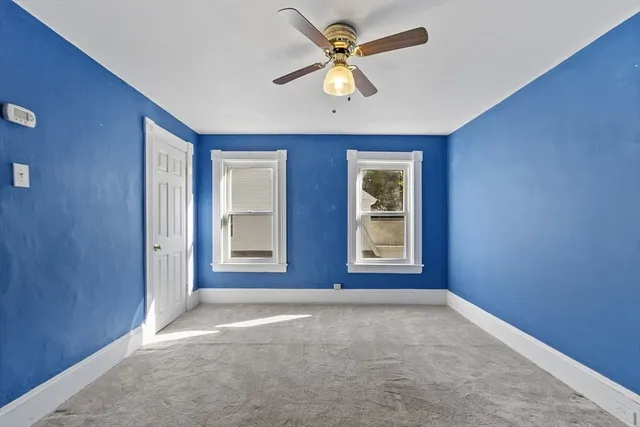 a view of livingroom with window ceiling fan