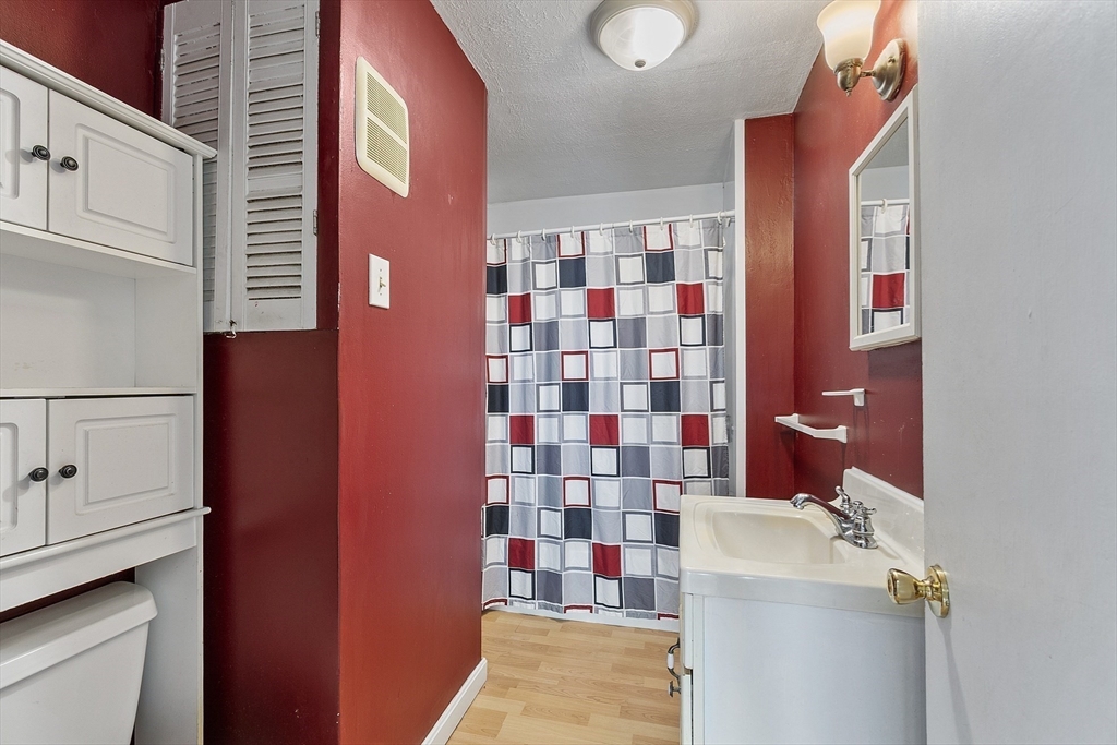111 Central Street Concord, MA 01742 - Photo 28 of 42 a bathroom with a sink toilet and shower