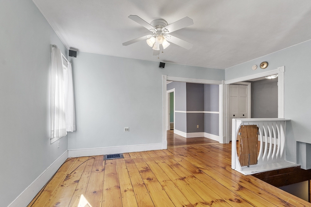 111 Central Street Concord, MA 01742 - Photo 7 of 42 a view of empty room with wooden floor and fan