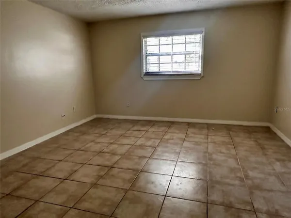 an empty room with a white door