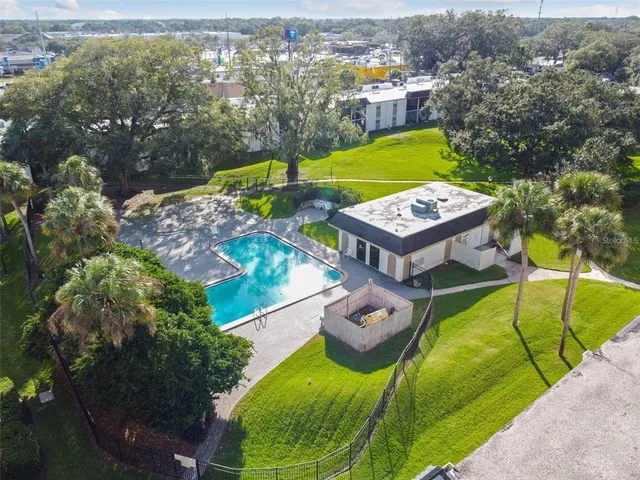 an aerial view of a house having swimming pool garden and patio