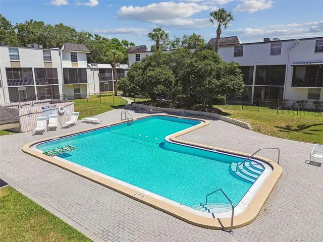 a view of a mini pool with a yard