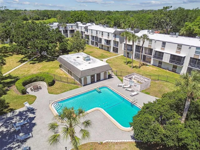 an aerial view of a house with a swimming pool