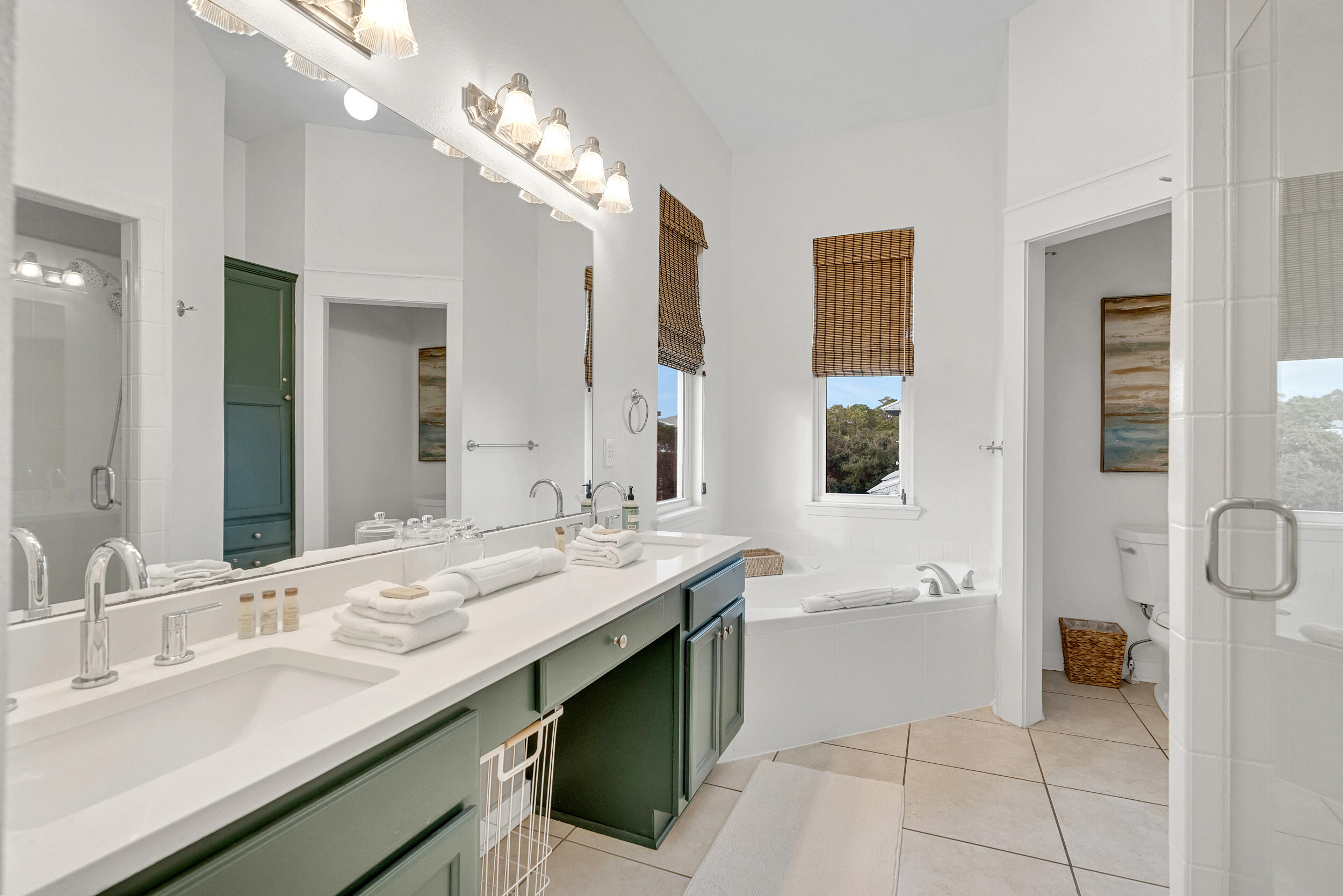 61 West Cobia Run, Unit 102 Inlet Beach, FL 32461 - Photo 15 of 37 a spacious bathroom with a sink double vanity granite and a mirror