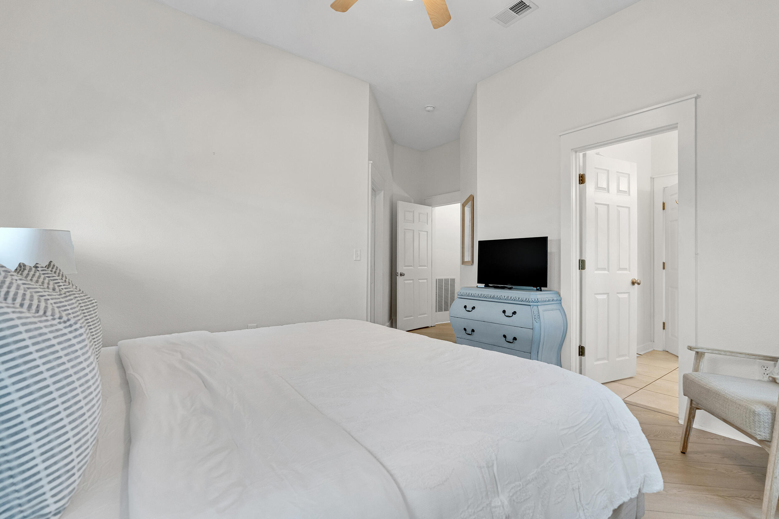 61 West Cobia Run, Unit 102 Inlet Beach, FL 32461 - Photo 18 of 37 a bedroom with a bed window and a flat screen tv